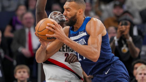 Minnesota Timberwolves center Rudy Gobert (27) fouls Portland Trail Blazers center Duop Reath (26) in the second quarter at Target Center in Minneapolis on March 4, 2024.
